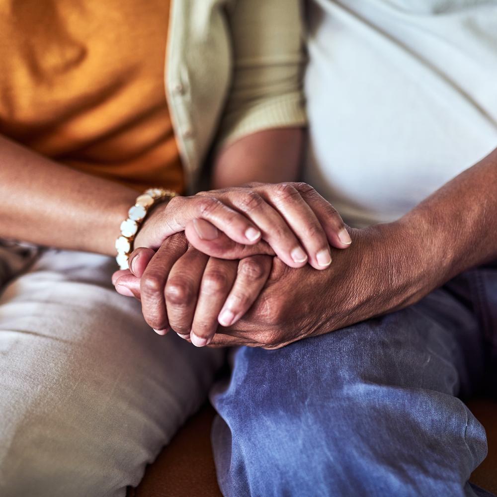 Senior hands clasped in comfort
