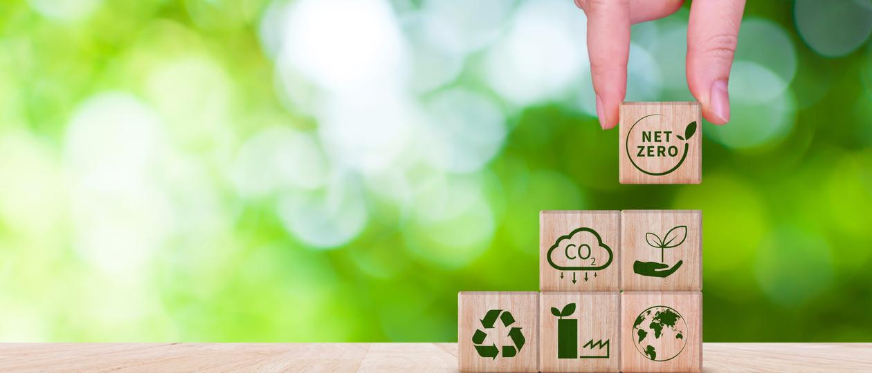 Hand placing net zero block